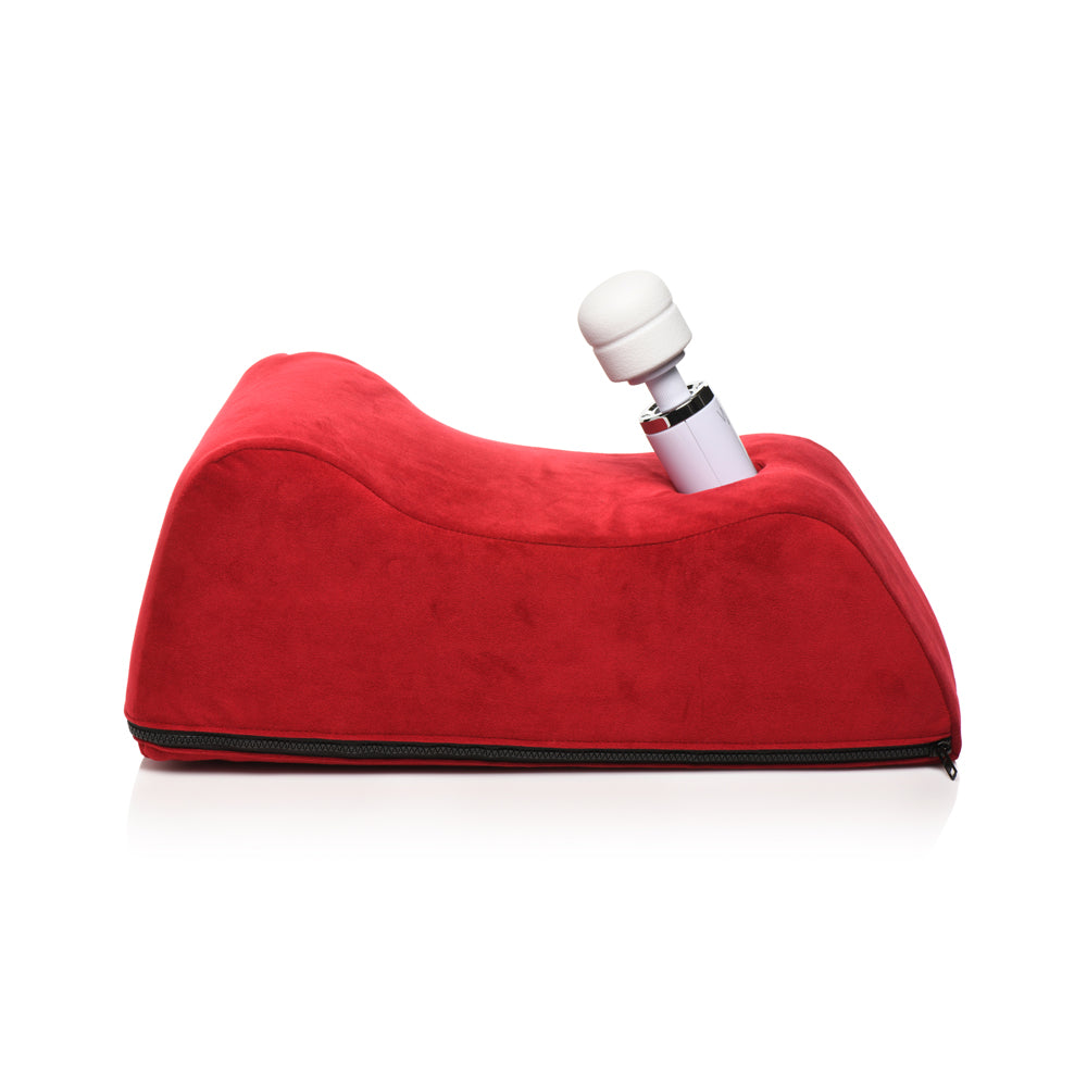 Red foam positioning pillow with a wand inserted.