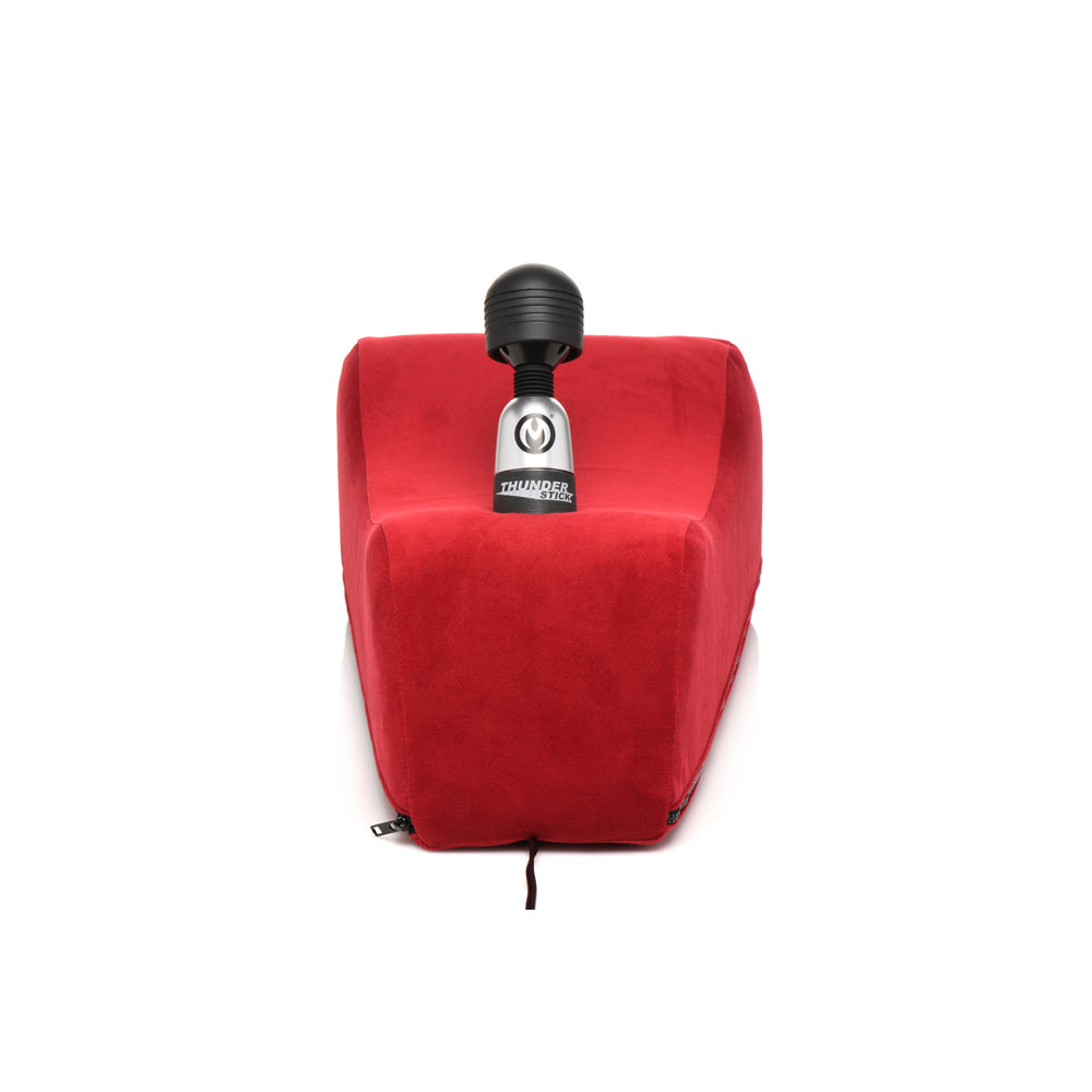 Red foam positioning pillow with a wand vibrator on top.