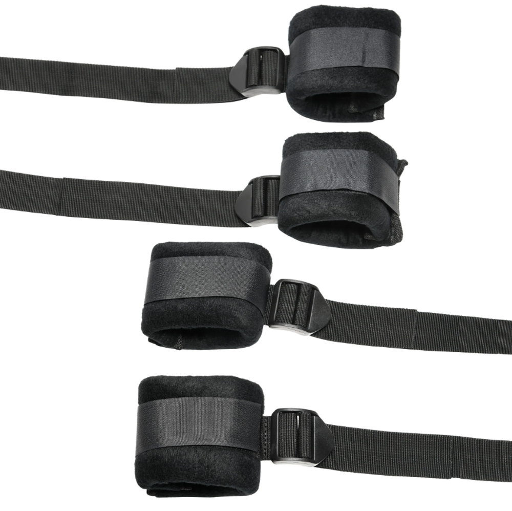 Black padded restraints with adjustable straps and buckles.