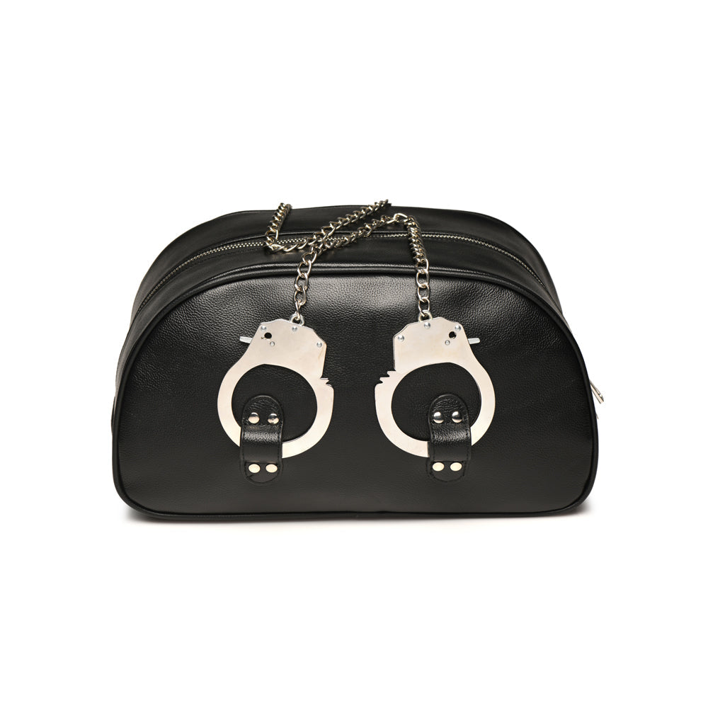 Black vegan leather travel bag with attached handcuffs.