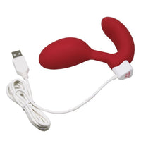 Red app-controlled G-spot vibrator and Kegel exerciser with USB charging cable.