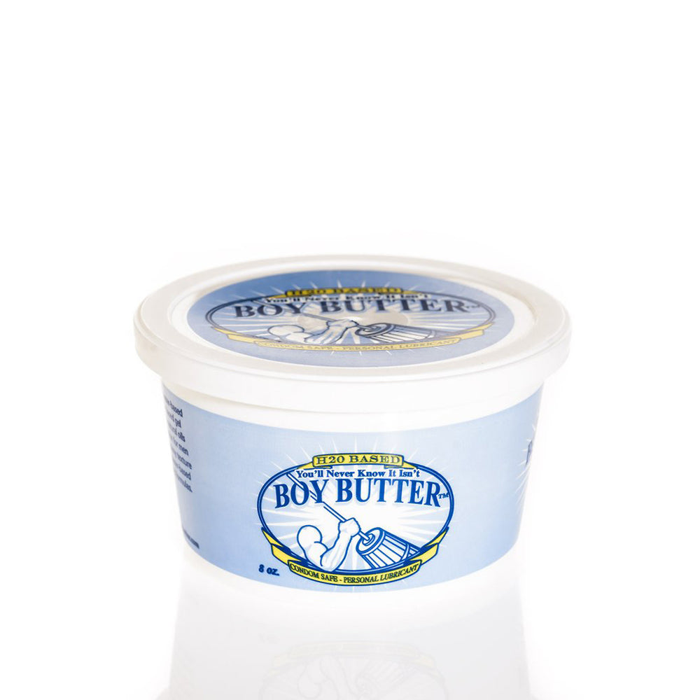 A white tub of Boy Butter water-based cream lubricant with a blue label.