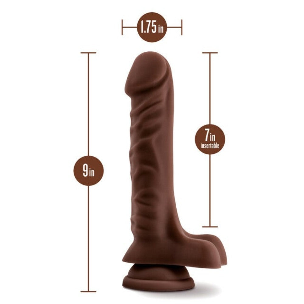 Realistic brown TPE dildo with suction cup base, 9 inches long and 1.75 inches wide.