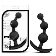 Black silicone anal beads with a flexible EZ handle.
