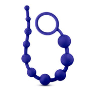 Indigo blue silicone graduating anal beads with a loop for easy handling.