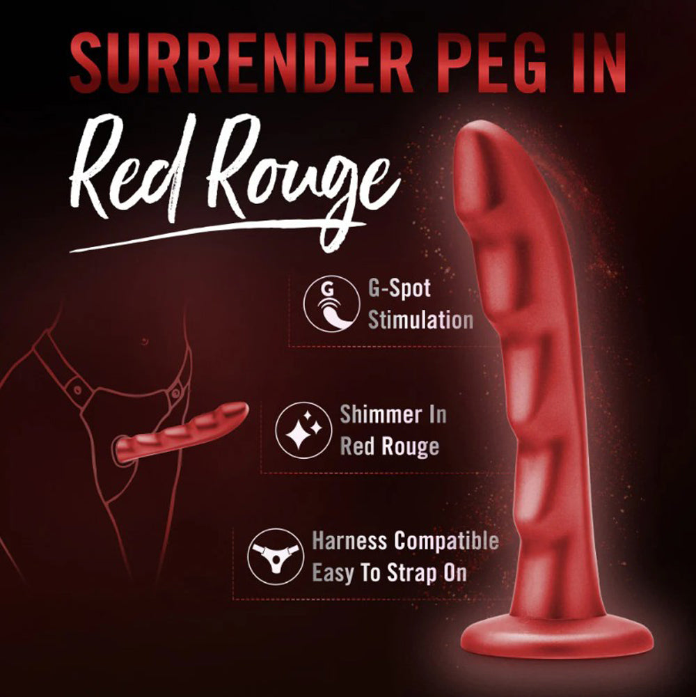 Red silicone G-spot dildo with harness compatibility.
