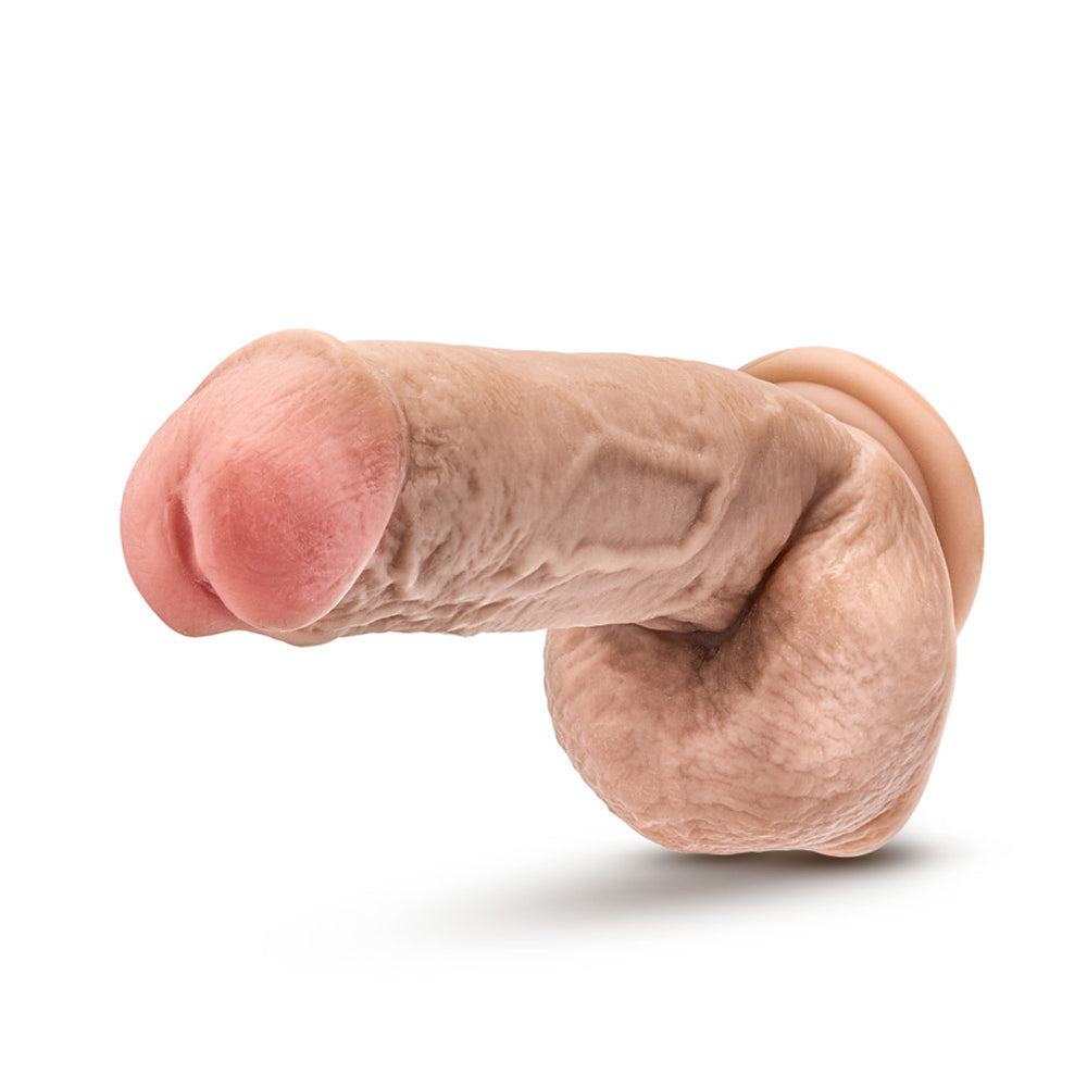Realistic 8.5-inch suction cup dildo with balls in flesh tone.