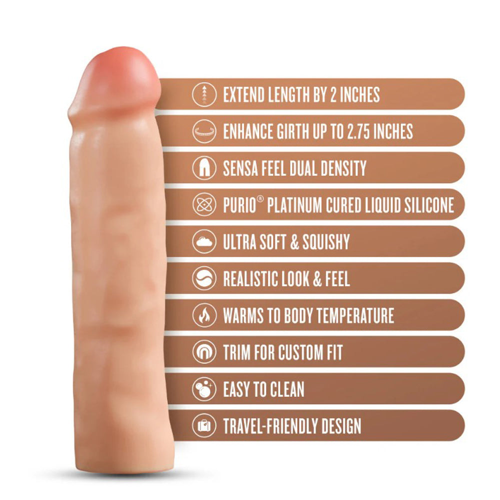 Blush silicone penis extender with dual density, blush color, and feature labels.