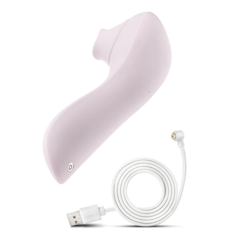 A blush pink clitoral suction and fluttering silicone massager with a charging cable.