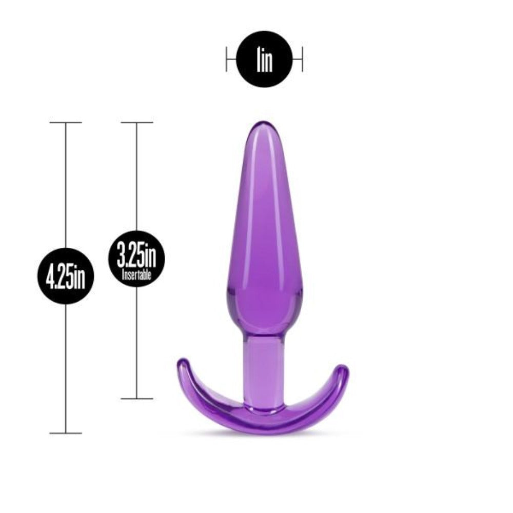 Purple silicone tapered anal plug with a flared base.