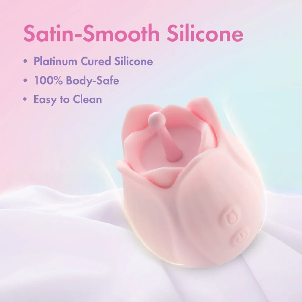 A pink, rose-shaped silicone massager with text about its features.