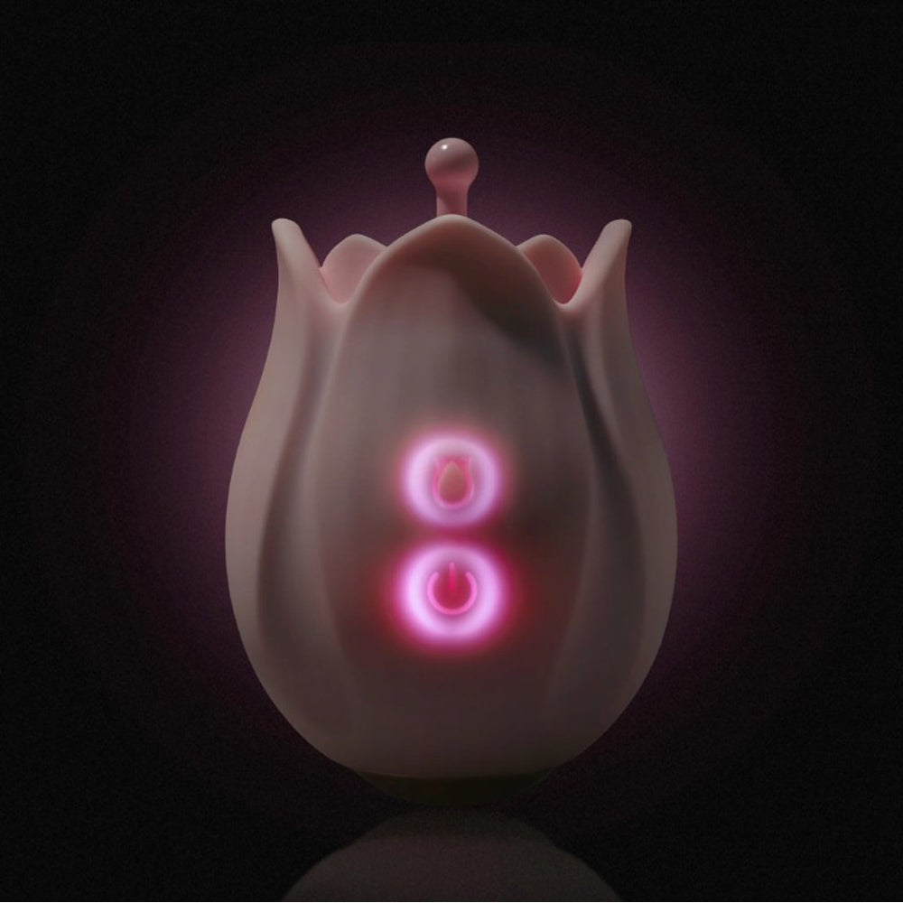 A pink, tulip-shaped clitoral massager with illuminated power buttons.
