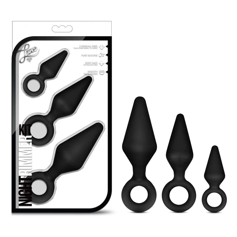 Three black silicone anal training plugs of varying sizes are displayed.