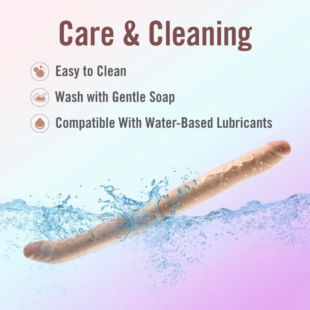 A realistic, beige, double-ended dildo submerged in water with care and cleaning instructions.