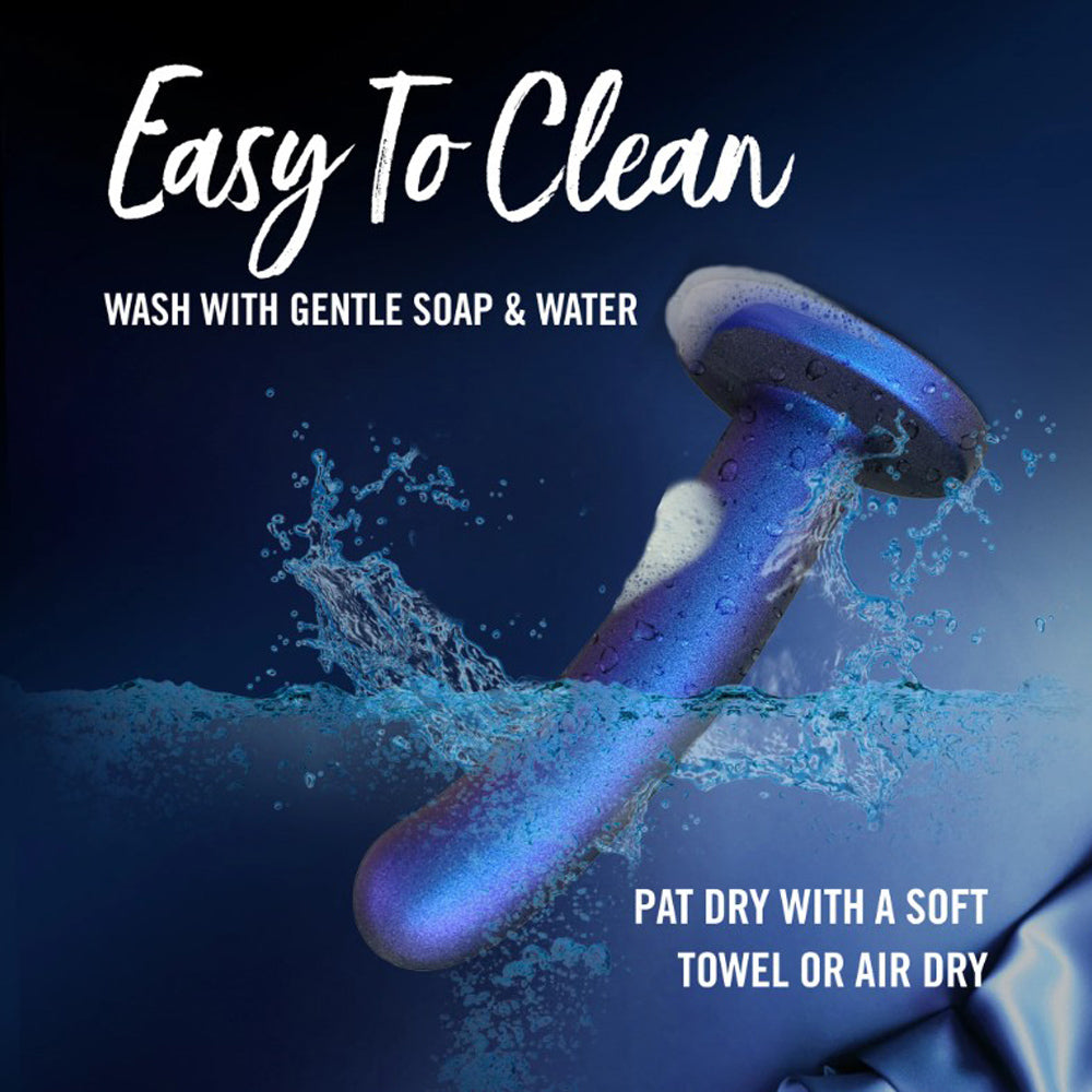 A blue and purple dildo with foam and water splashes.
