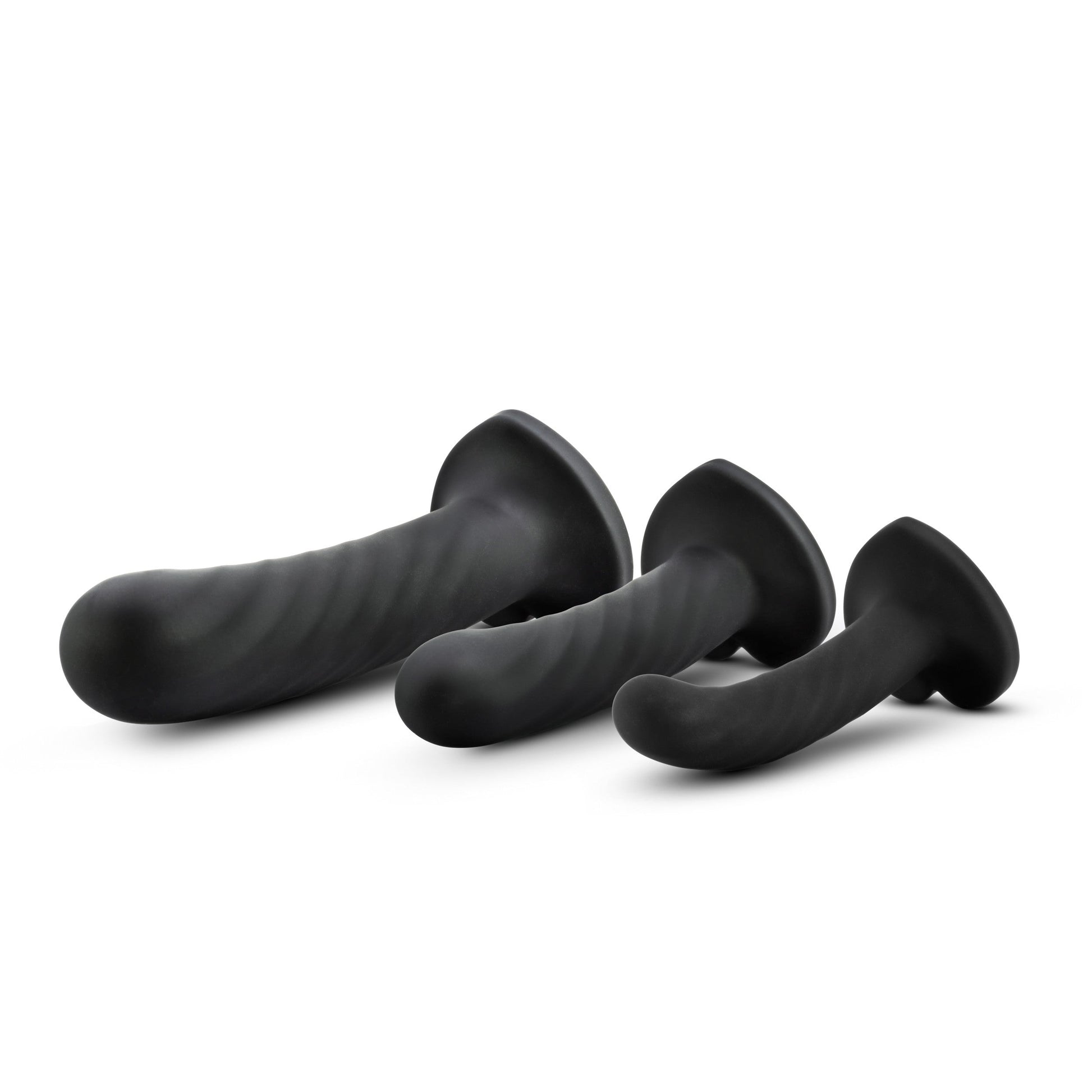 Three black silicone dildos of varying sizes with twisted textures and flared bases.