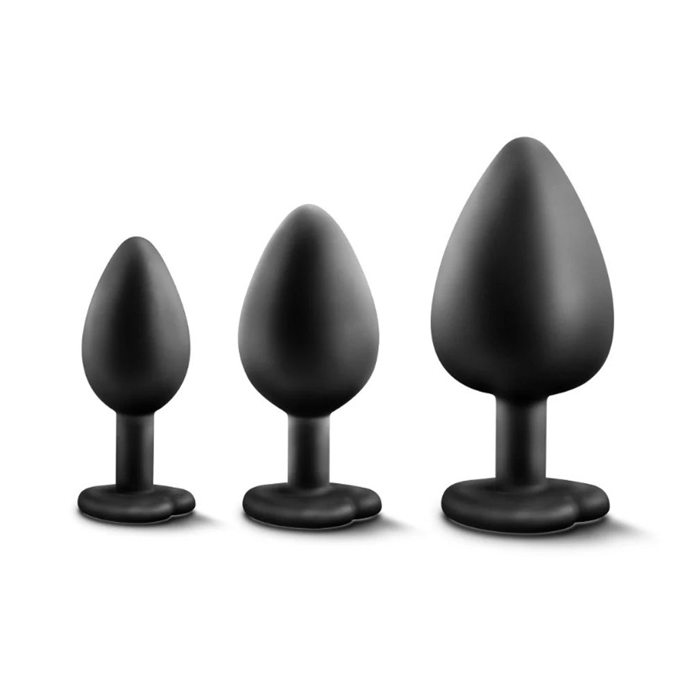 Three black silicone anal plugs of increasing size on a white background.