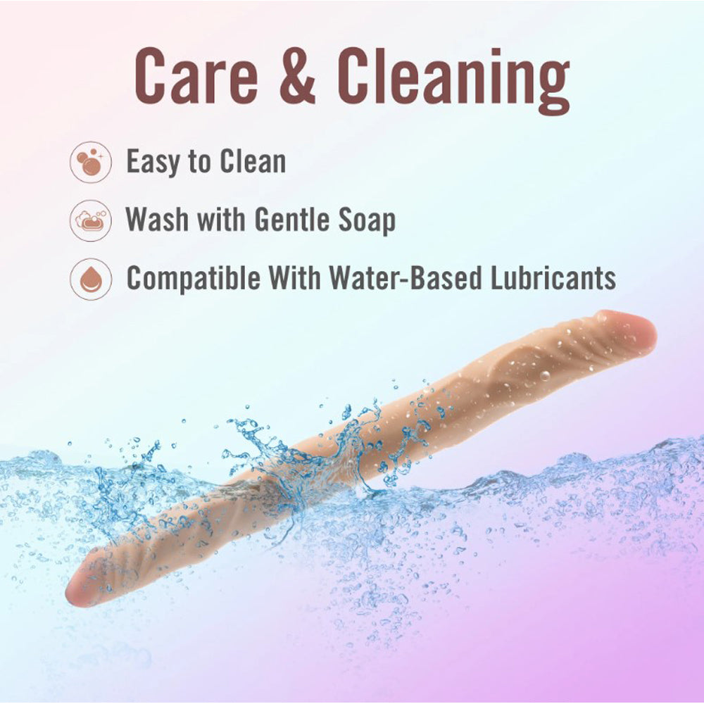 A realistic, beige, double-ended dildo submerged in water.