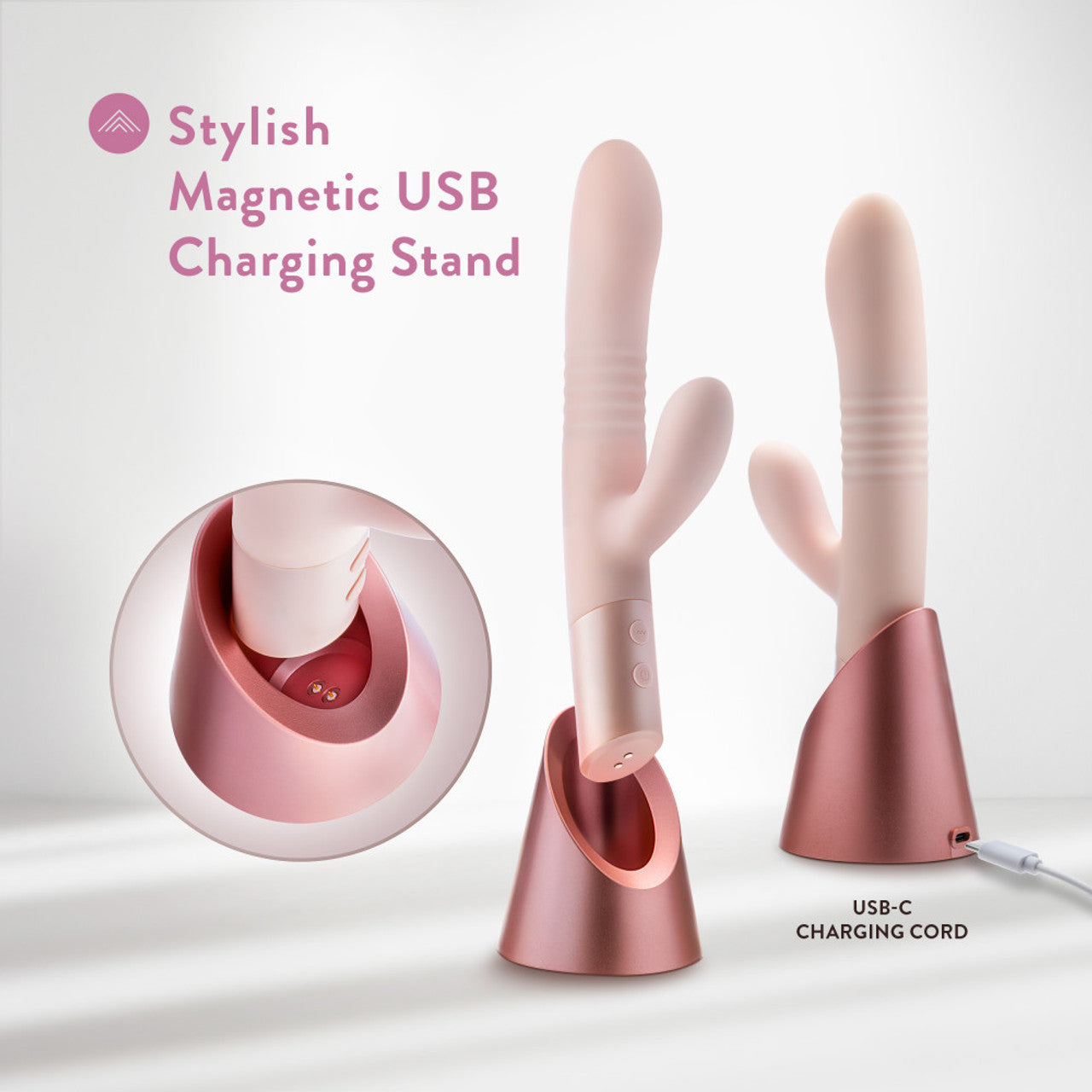 Two blush-colored rabbit vibrators with ribbed shafts stand in rose gold magnetic USB charging bases.