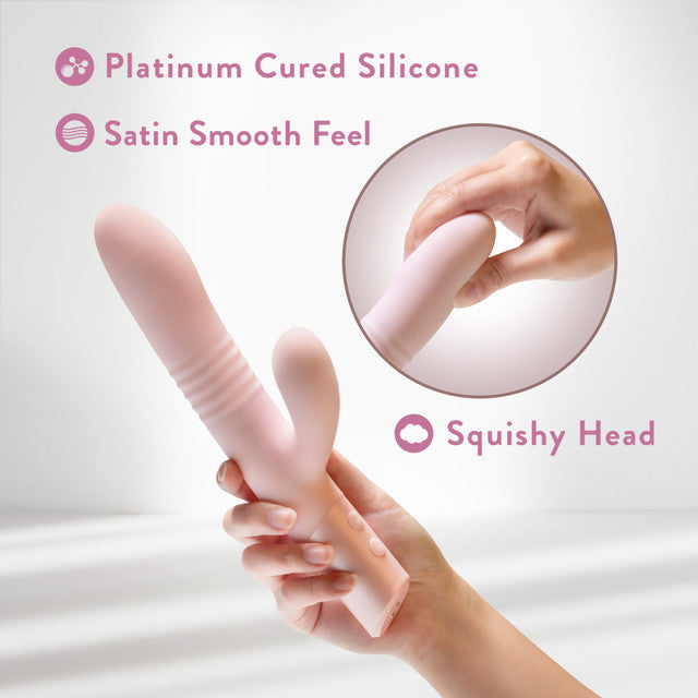 A pink silicone rabbit vibrator with ribbed texture and a squishy head.