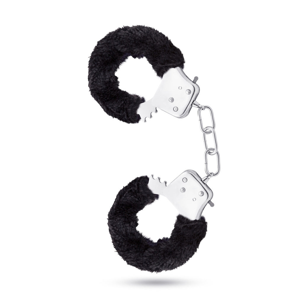 Black faux fur lined stainless steel handcuffs with a chain.