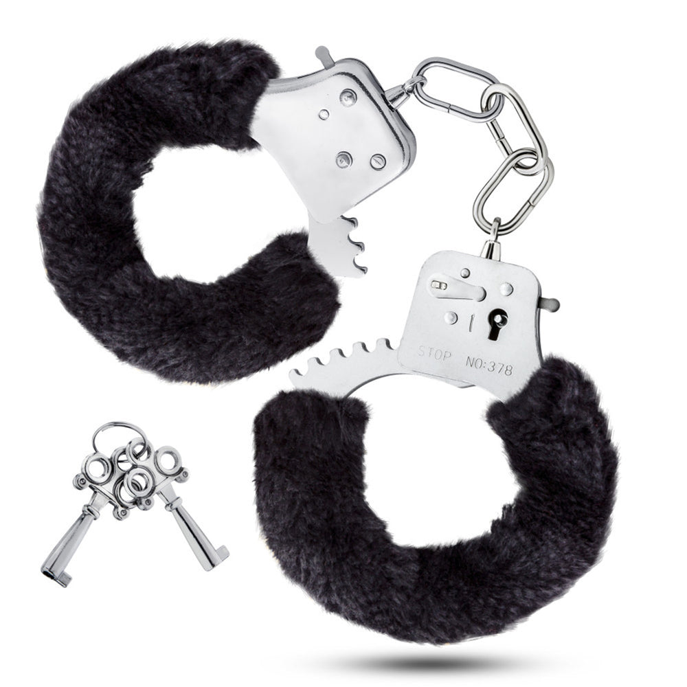 Stainless steel handcuffs with black faux fur lining and two keys.
