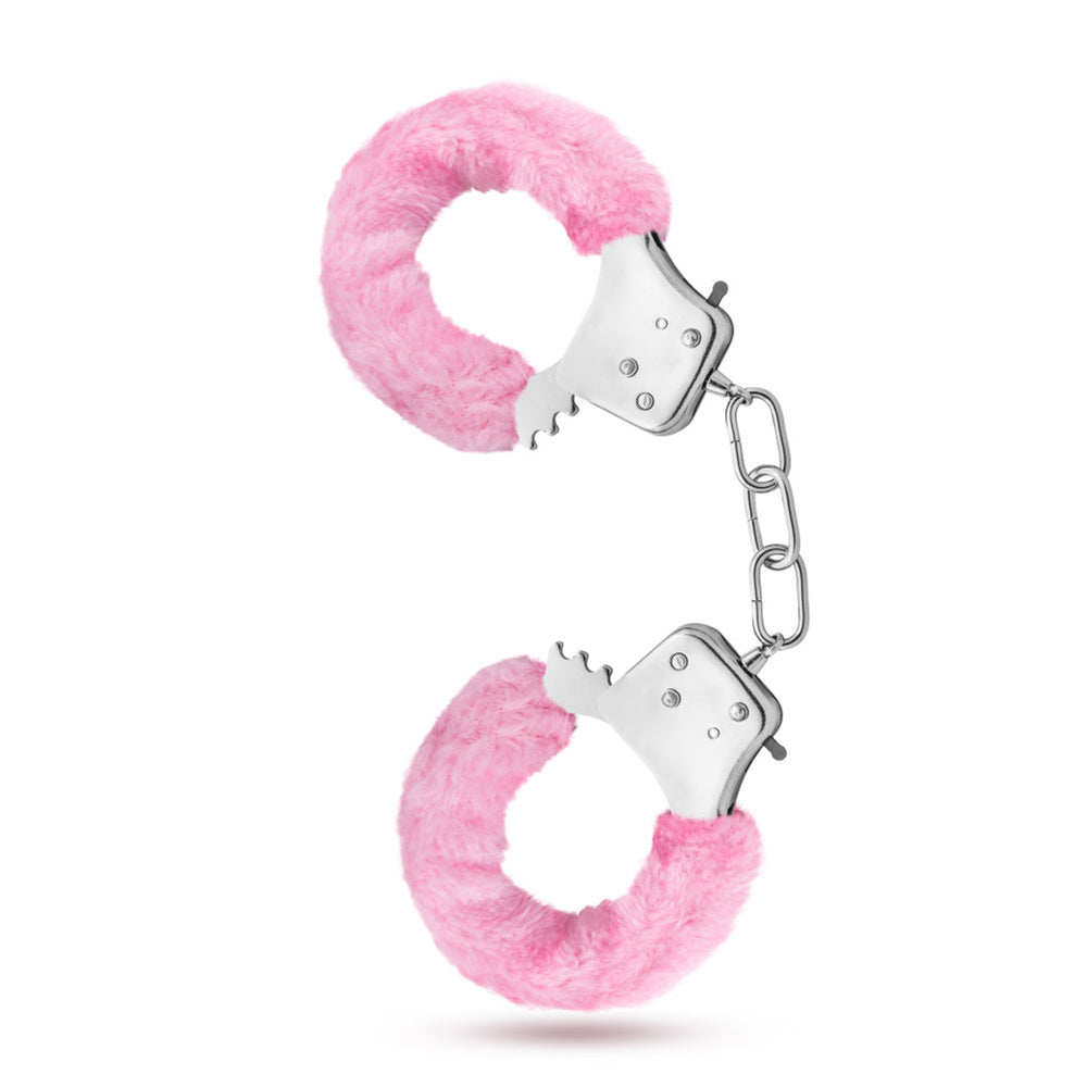 Pink faux fur handcuffs with metal chain and locking mechanism.