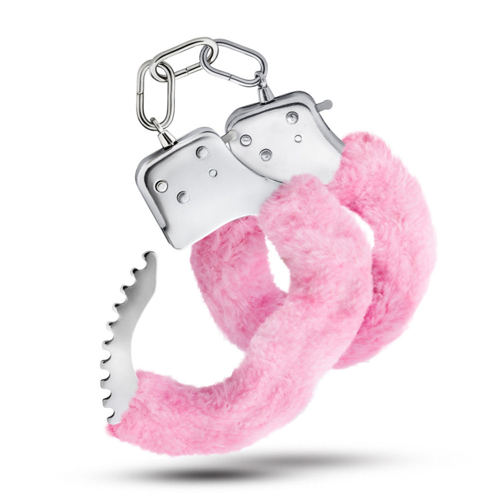 Pink faux fur-lined metal handcuffs with a chain.