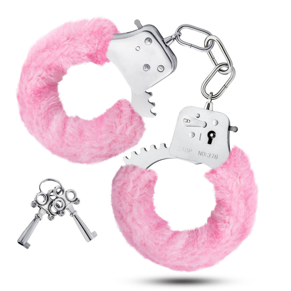 Pink faux fur-lined metal handcuffs with two keys.