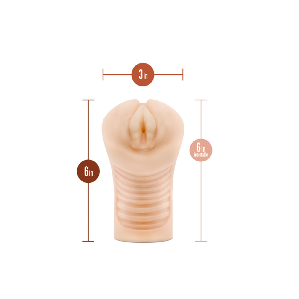 A blush-colored textured stroker with dimensions labeled.