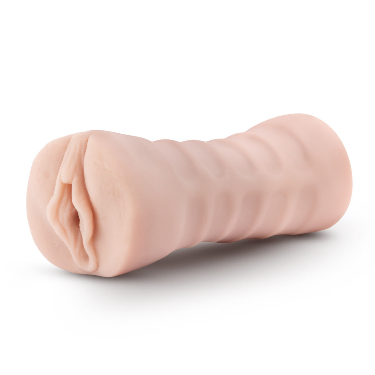Beige vibrating male stroker with textured exterior and realistic opening.