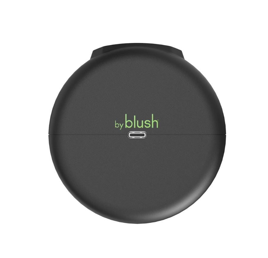 A black, round automatic stroker with the "by blush" logo and a USB-C port.