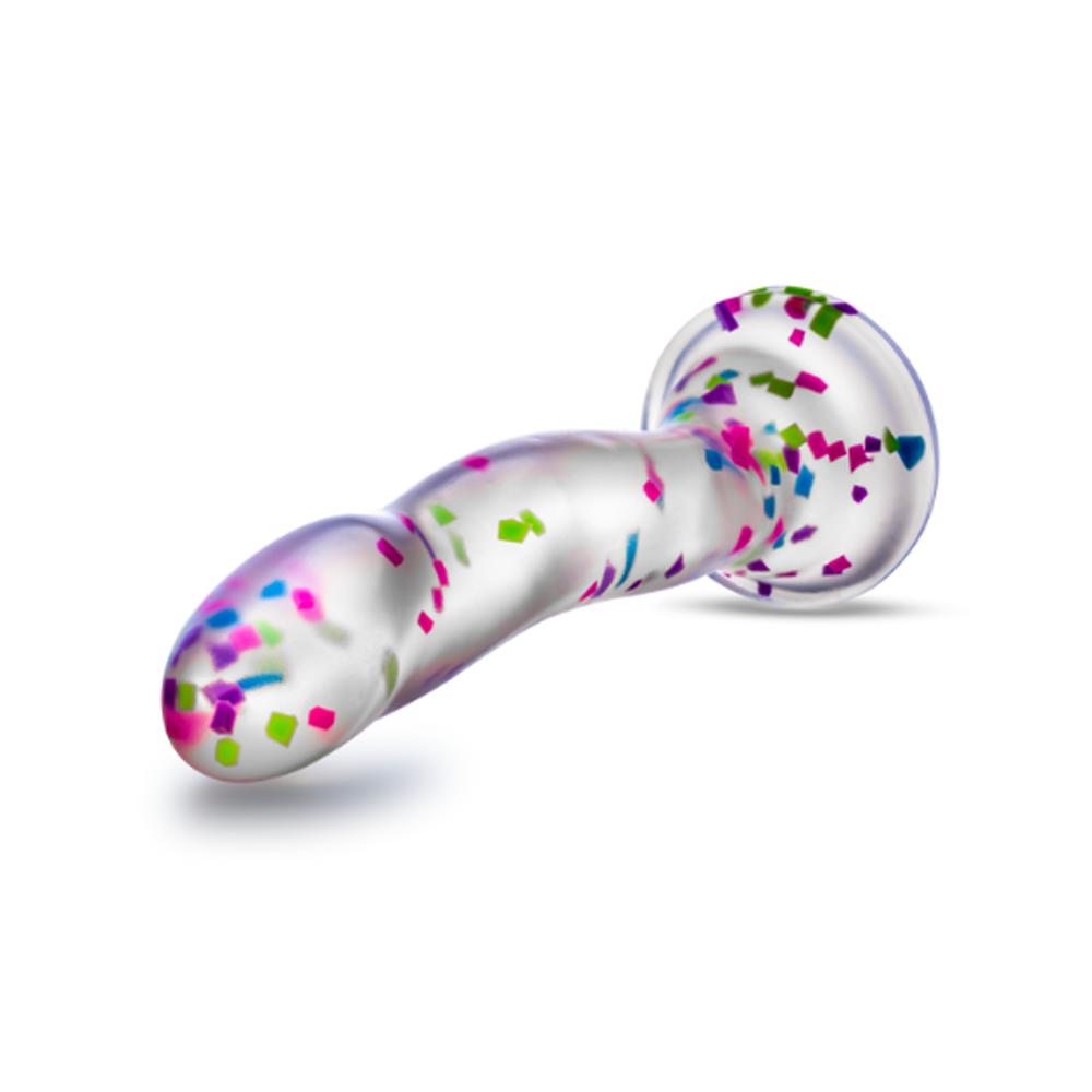 Clear dildo with colorful confetti and a suction cup base.