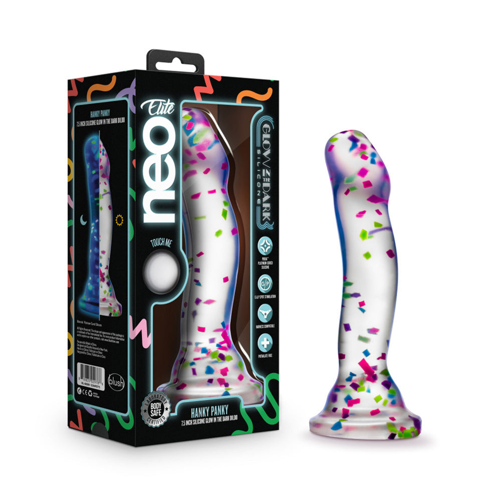 Clear silicone dildo with confetti and a suction cup base.