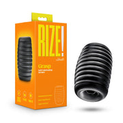 Black ribbed stroker with dual chambers and text on packaging.