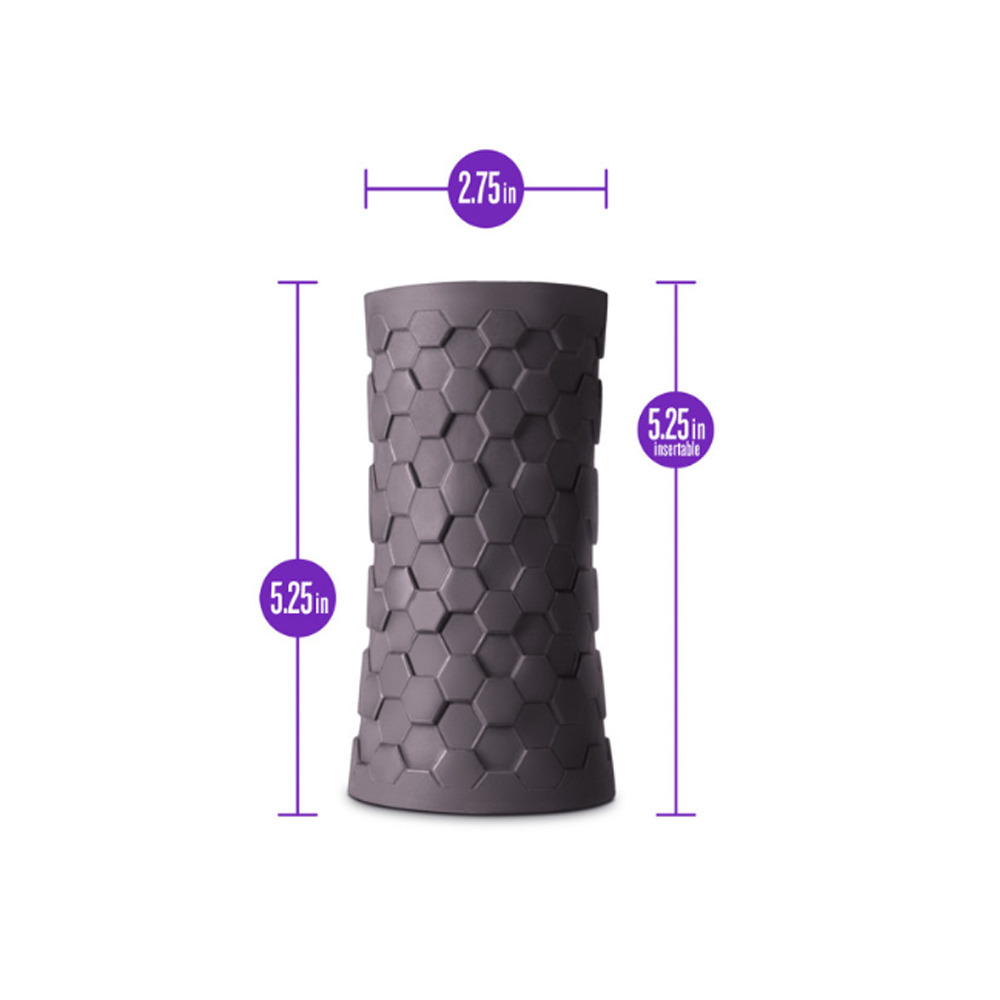 A grey hexagonal silicone stroker with dimensions indicated.