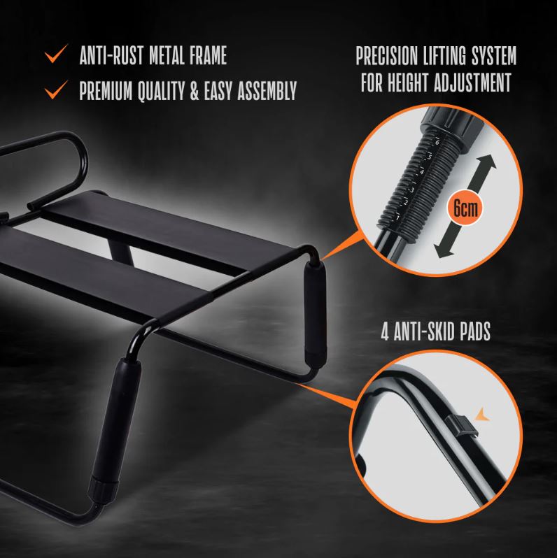 A black sex chair with a lifting system and anti-skid pads.