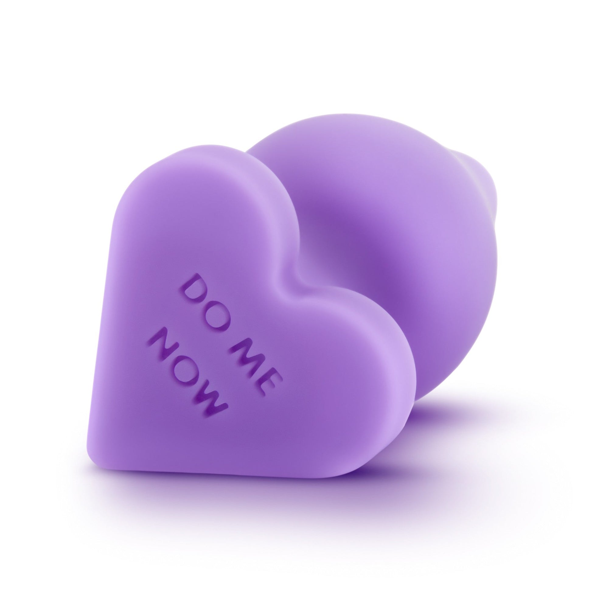 Purple silicone heart-shaped anal training plug with "DO ME NOW" text.