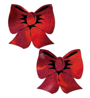 Two holographic red bow nipple pasties with black accents.