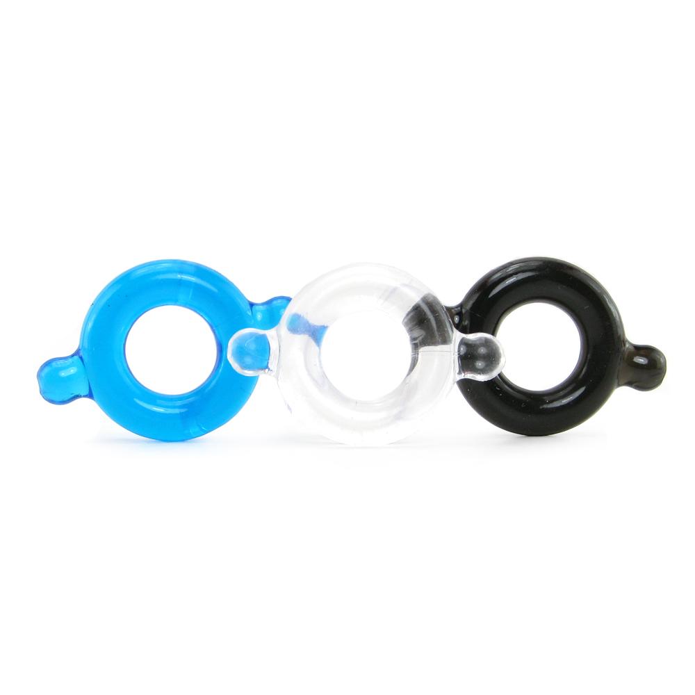 Three flexible elastomer cock rings in blue, clear, and black.