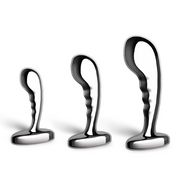 Three stainless steel prostate training plugs of varying sizes.