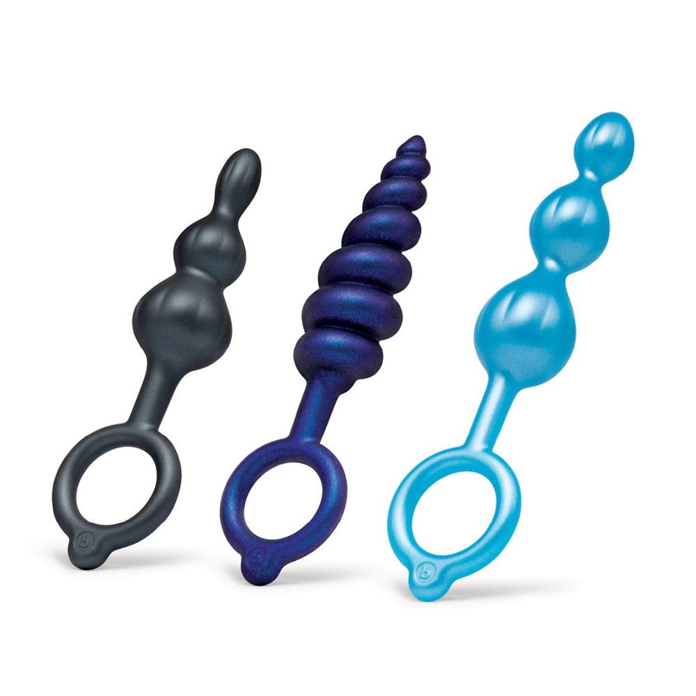Three silicone anal plugs in black, purple, and blue with beaded textures.