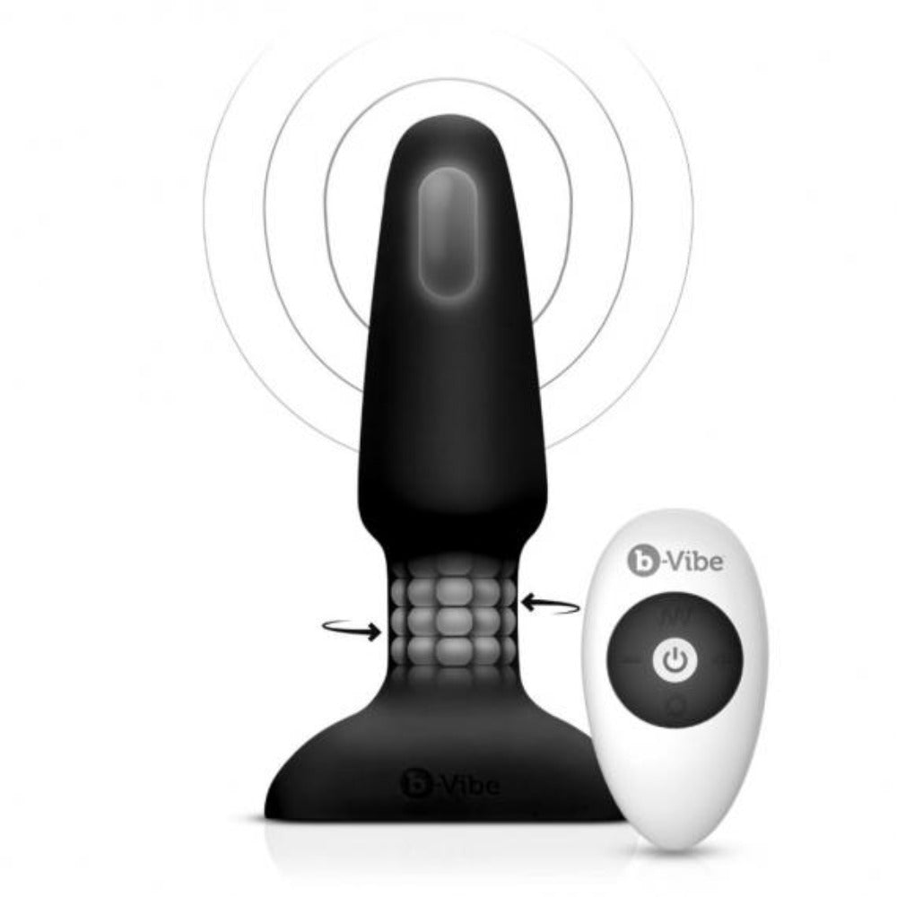 Black silicone rimming plug with textured rotating beads and a white remote control.