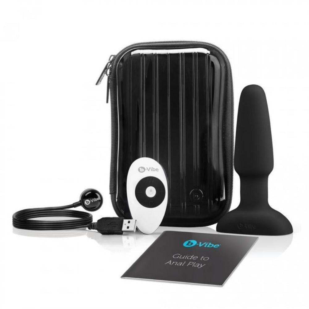 Black silicone anal plug with remote, charging cable, and travel case.