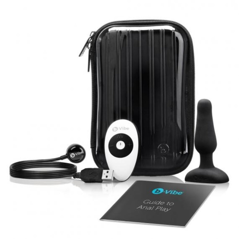 Black vibrating silicone anal plug set with remote and travel case.