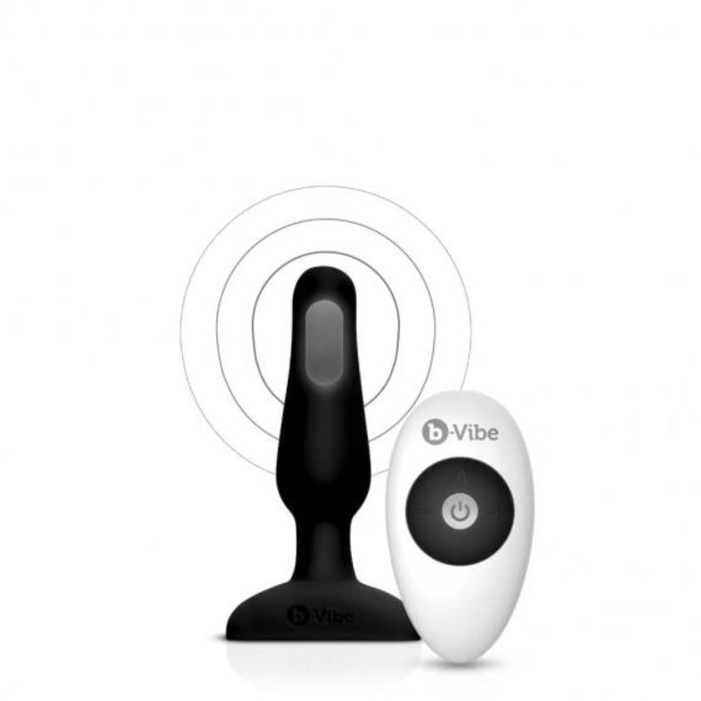 Black silicone anal plug with a white remote control.