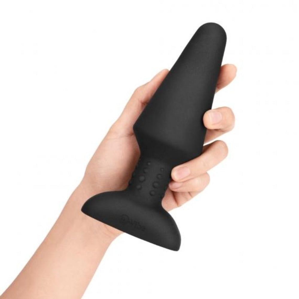 Black silicone XL anal plug with a flared base and textured shaft.