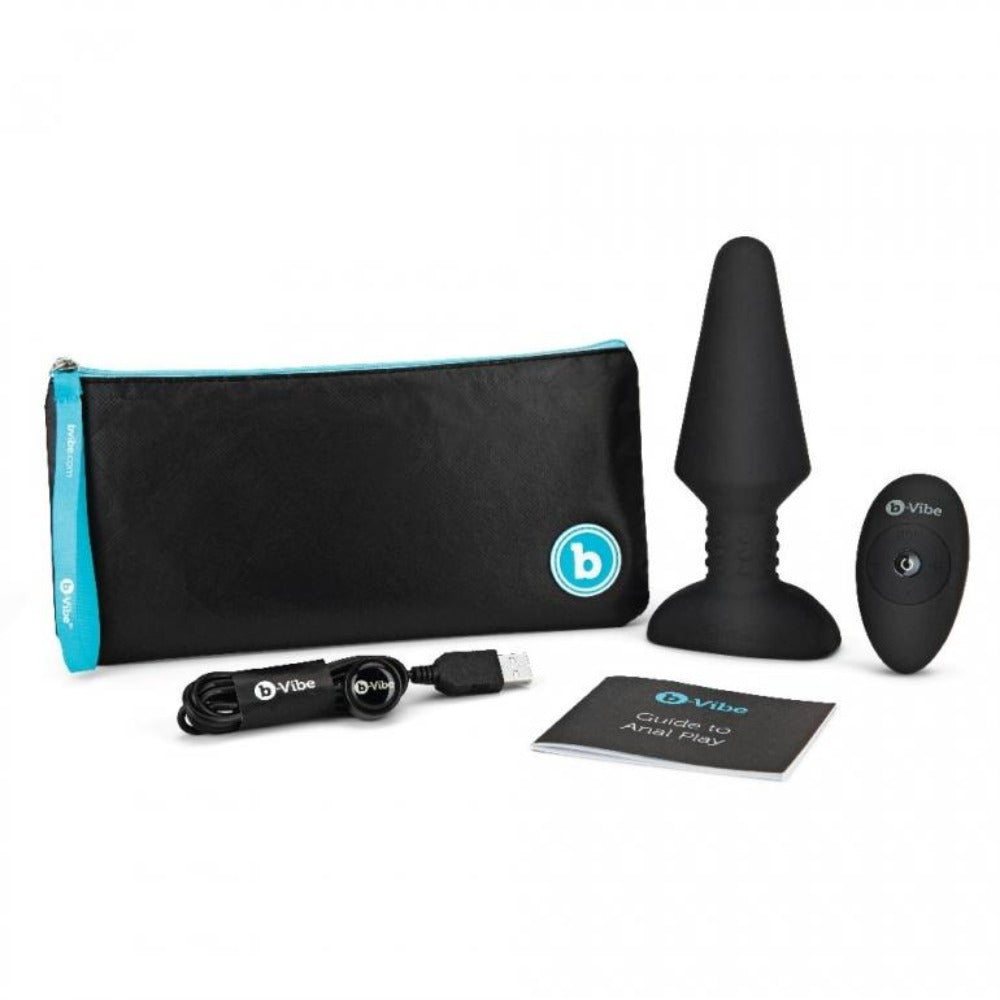 Black silicone anal plug with remote, charging cable, pouch, and guide.