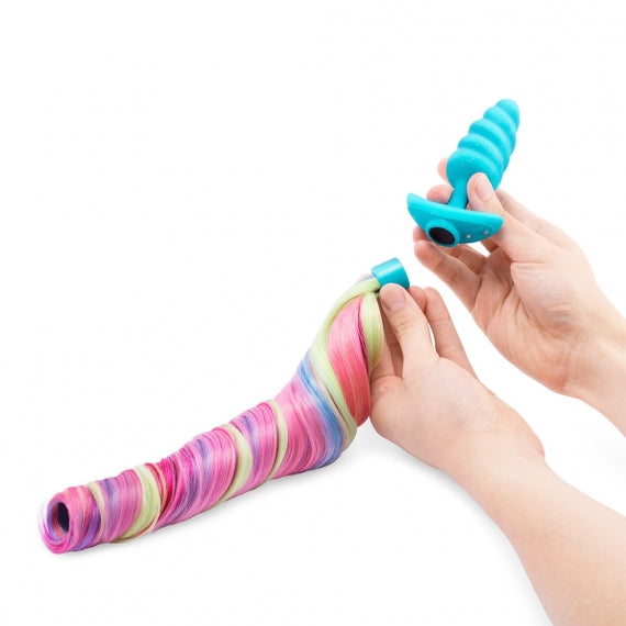 A vibrating unicorn anal plug with a removable rainbow tail.