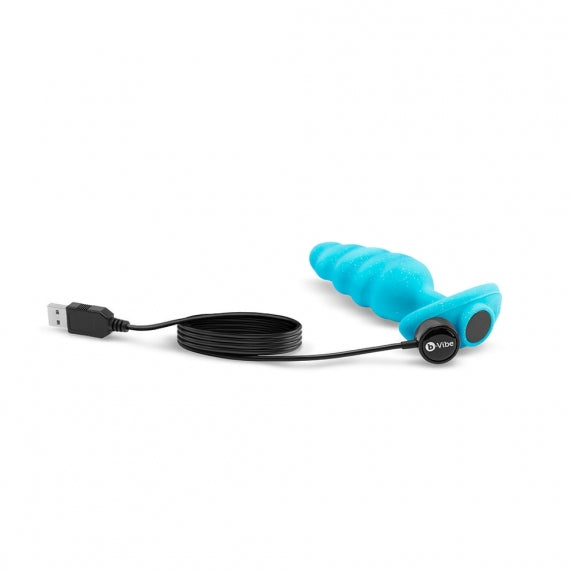 A blue vibrating anal plug with a USB charging cable and a black control button.